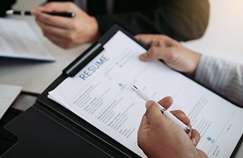 pannel reviewing a cv 